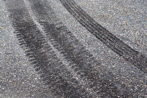 skid steer tire marks on driveway|concrete driveway tire marks.